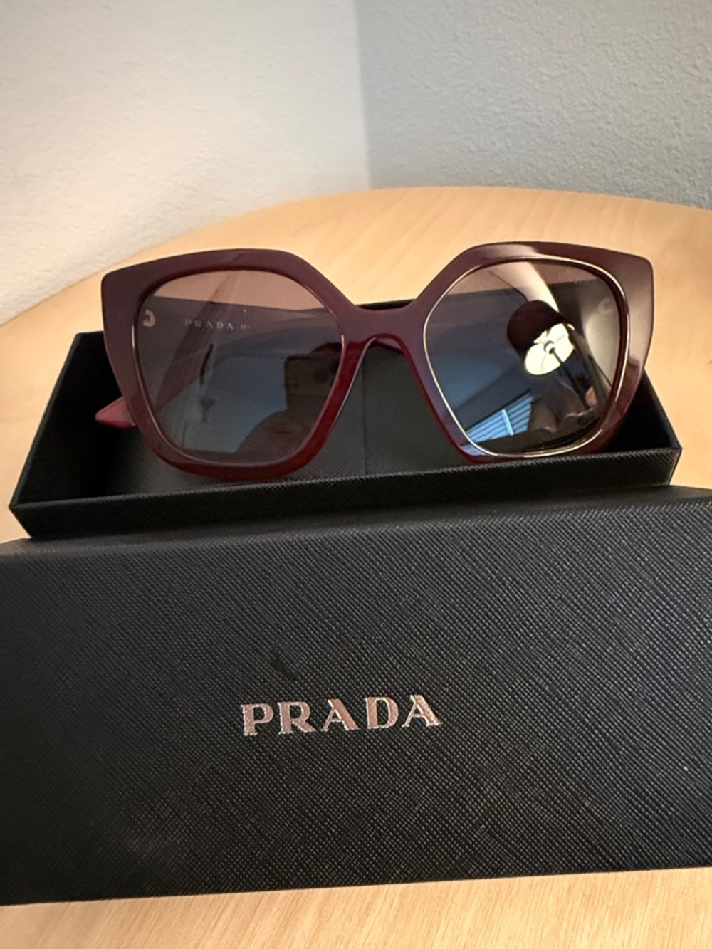 Prada Women’s Burgundy Oversized Cat-Eye Sunglasses with Gradient Lenses